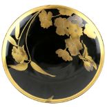 Leonard Paris Hutchenreuther, footed dish with gilt foliate decoration on a black ground, issued in