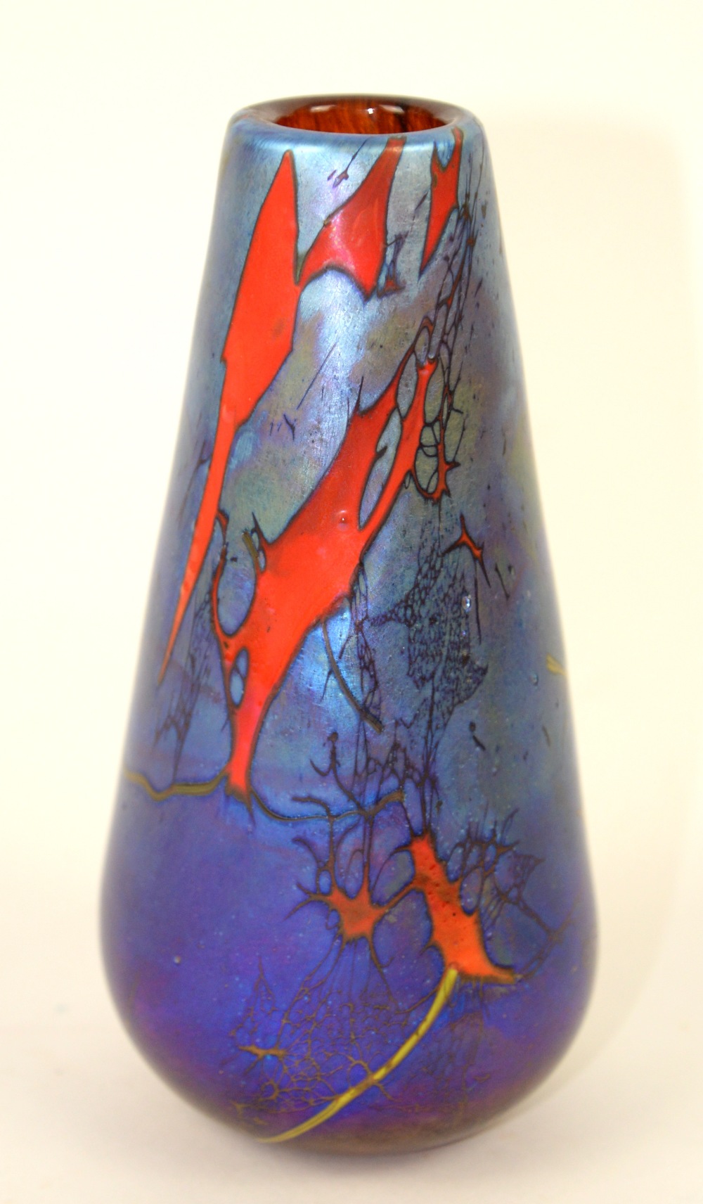 Siddy Langley Glass - Tapering bud vase with iridescent purple ground highlighted in red and gold,