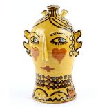 Mary Wondrausch, a slipware decorated head, depicting a lady with heart decorated cheeks and a