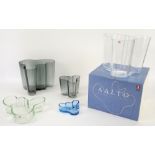 Alvar Aalto for Iitala, Finland, four clear glass savoy vases and one small blue glass savoy dish,