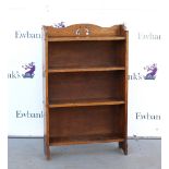 Oak open bookcase with pierced backrail and two fixed shelves, 117 x 74 x 20 cm .