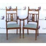 Pair of Arts and Crafts oak arm chairs, the back rails with pierced inverted heart, lift out