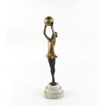 Art Deco style patinated bronze figure of a dancing girl with ball, on cast resin base, later 20th C