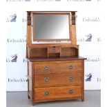 Arts and Crafts oak dressing chest, the mirror supports carved with floral motif, drawers with