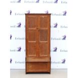 Early 20th C oak hall cupboard, the panelled doors opening to reveal hanging space, above small