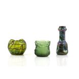 A group of Art Nouveau glass, a green iridescent glass vase with applied decoration, another with