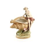 Art Nouveau Royal Dux figure of a nude maiden with lilies in her hair, and body reclined on a