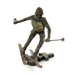 Phil Hazard cast metal study of a skier, signed, 20 cm .