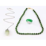 Jadeite jade carved ring, a nephrite jade necklace, and a banded agate pendantTo be sold in aid