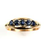 Dress ring, set with five round cut blue sapphires, ring size V, mount stamped 14 ct. CONDITION 14