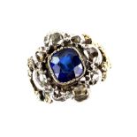 Antique style ring set with central synthetic sapphire, surrounded by rose cut diamond, mount