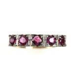 Vintage dress ring, set with five round cut rubies, ring size U, mount stamped 14 ct . CONDITION14