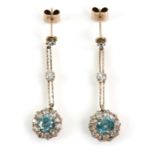 A pair of vintage drop earrings set with blue zircon and white sapphire mount testing as 9 ct,