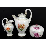 Dresden porcelain teapot, cream jug with swan handle and floral decoration and a sugar bowl with