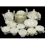 19th century Staffordshire tea service decorated with stylised green flowers, comprising teapot,