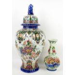 Dutch delft vase and cover with cat finail, the body decorated with flowers, 57cm and similar vase