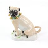 Meissen figure of a pug with suckling pup, on naturalistic base, underglaze blue crossed swords