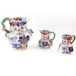 19th Century Masons Ironstone Imari pattern, two octagonal jugs with serpent handle, 18cm, and a