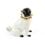 Meissen figure of a sitting pug, blue collar with gold bells, underglaze blue crossed swords mark,