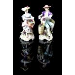 Pair of 19th Century Sitzendorf grape collectors figurines, of a man and woman with baskets of