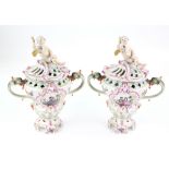 Pair of 19th Century Dresden pierced urns with twin handles in the form of serpents, decorated
