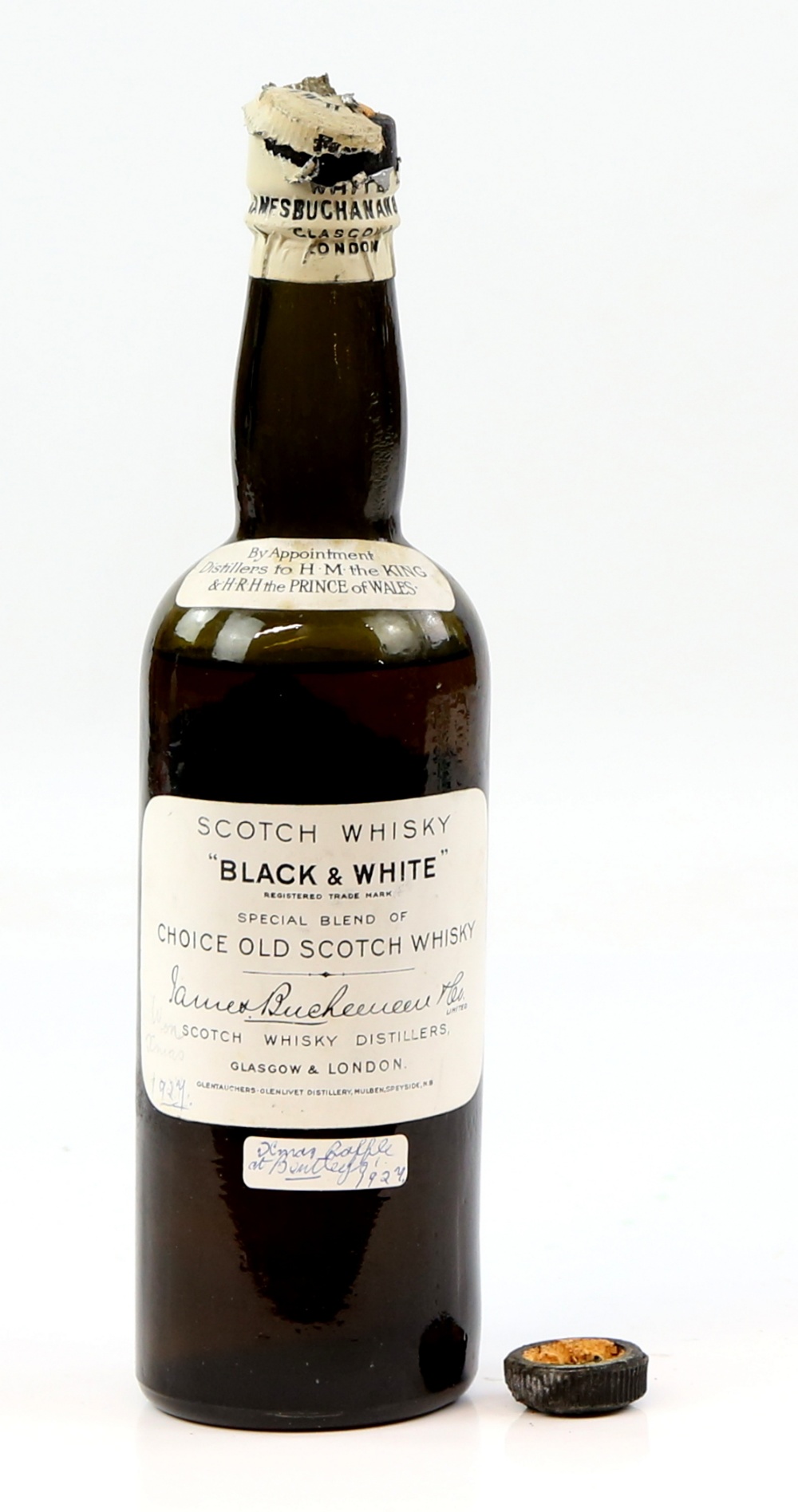 One bottle of 'Black and White' Choice Old Scotch Whiskey. 1927. Cap detached from cork, cork