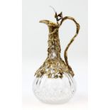 Garrard & Co Ltd gilt-metal mounted glass claret jug, decorated with fruiting vines, 27 cm high.