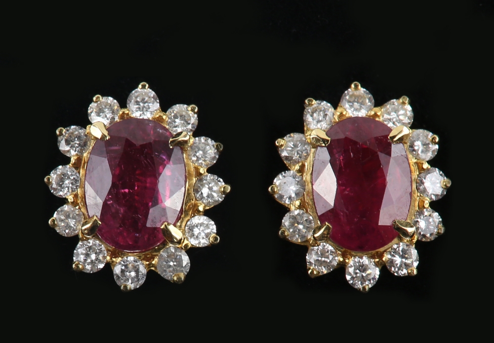 A pair of ruby and diamond earrings, oval faceted stones within a border of diamonds, in unmarked - Image 3 of 6