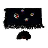 A Portuguese black silk floral embroidered shawl and a black feather fan with faux tortoiseshell