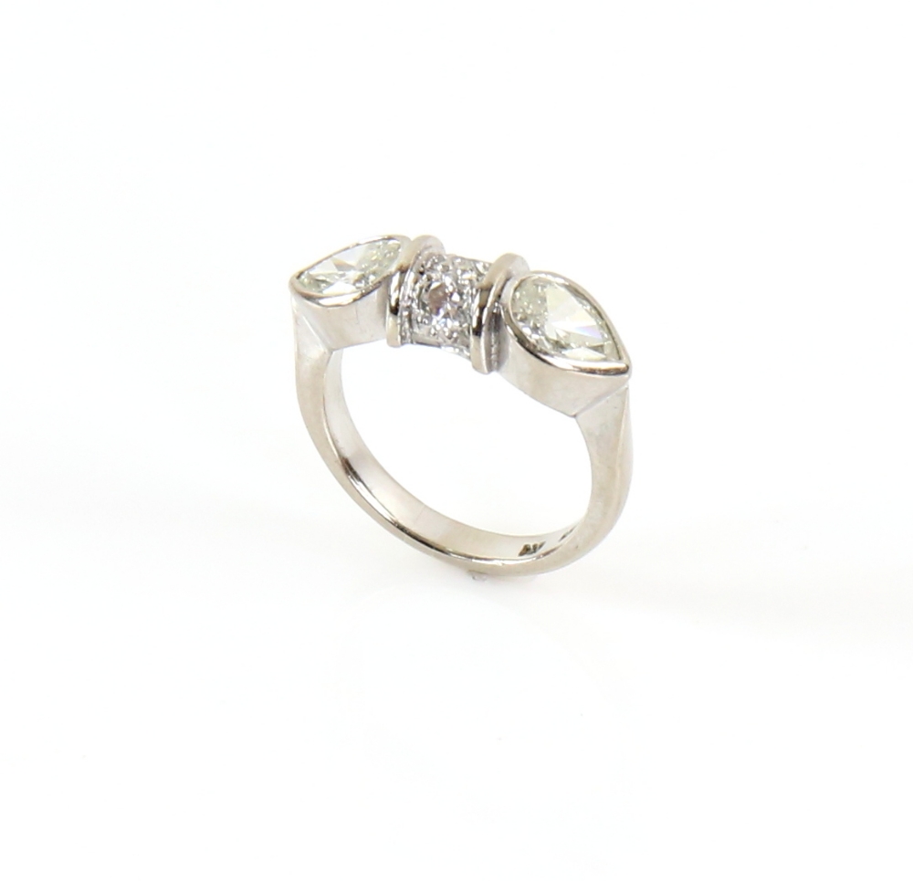 Contemporary diamond ring; two pear form stones with central bezel set with two round cut stones, - Image 5 of 6