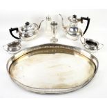 Silver vase, silver-plated tea tray, three piece tea service and sugar sifter .