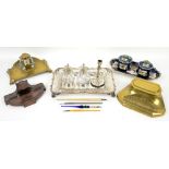 A comprehensive collection of inkwells and associated items, including travelling inkwells and a