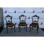 Set of six Victorian mahogany side chairs on cabriole front supports.