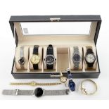 A group of watches including Fossil, Rotary, Pulsar, Guessm Timex, Wenger, all in one presentation