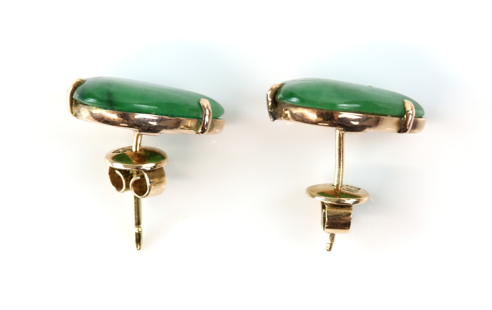 A pair of nephrite jade earrings, pear cabochon cut jade, claw set in gold stamped 14 ct, post and - Image 3 of 4