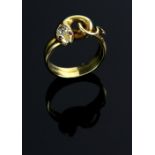 Victorian gold snake ring, the head set with a diamond of 0.25 carats and ruby eyes, in unmarked