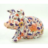 An Imari figure of a seated pig, 20th Century. Chip and crack to left ear, superficial marks,