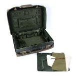 A Harrods Ltd leather dressing case with green silk lined interior fitted with various
