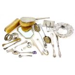 Selection of silver and silver-mounted items, including a pair of berry spoons, two napkin rings,