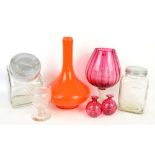 Group of glass including a large orange lamp base, cranberry glass, a clear sweetie jar, etc.