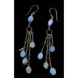 Opal drop earrings, cabochon cut opals in a spectacle setting, in a graduated chandelier design,
