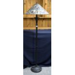 Modern Tiffany style floor lamp with conical stained glass shade.