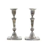 Pair of 18th Century style silver candlesticks, weighted, Sheffield, 1924, height 23 cm .