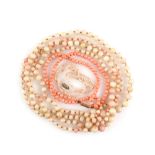 A Victorian coral bead necklace to a barrel clasp in 15 ct gold, length 42 cm, another coral