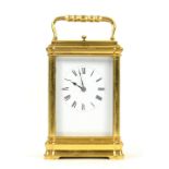 Brass and four glass carriage clock with lever movement and repeat button, 18.5cm high.