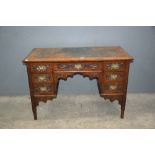 19th century small kneehole desk, oak barrel or log basket with badge for Courage and Co Alton, a