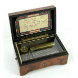 6 Air cylinder music box with Yankee Doodle, fitted in an amboyna veneered box, 13.5cm x 6cm.