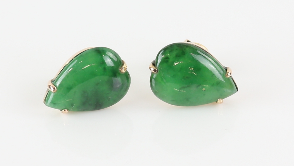 A pair of nephrite jade earrings, pear cabochon cut jade, claw set in gold stamped 14 ct, post and - Image 2 of 4