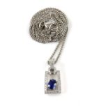 Contemporary sapphire and diamond pendant, set with an oval cut blue sapphire, estimated weight 0.53