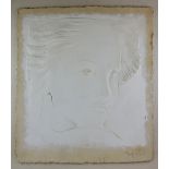 Plaster relief of a woman, signature indistinct.